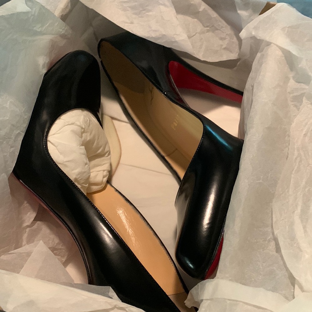 Christian Louboutin red bottoms, size 8 (39), never worn.